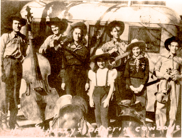 Hank Williams and the Driftin' Cowboys Band, 1938. Irene Williams Smith is 3rd from left and Hank Williams is 5th. Photo from Wikimedia Commons.